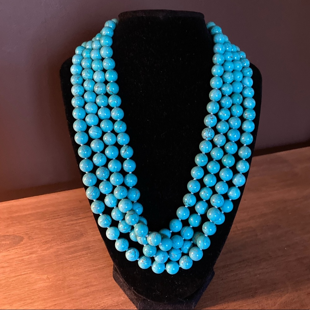 Turquoise bead knotted necklace.